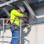 CROM Employee working safely